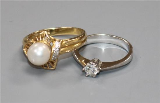 A 14ct white gold and solitaire diamond ring and a 14ct gold, cultured pearl and diamond dress ring.